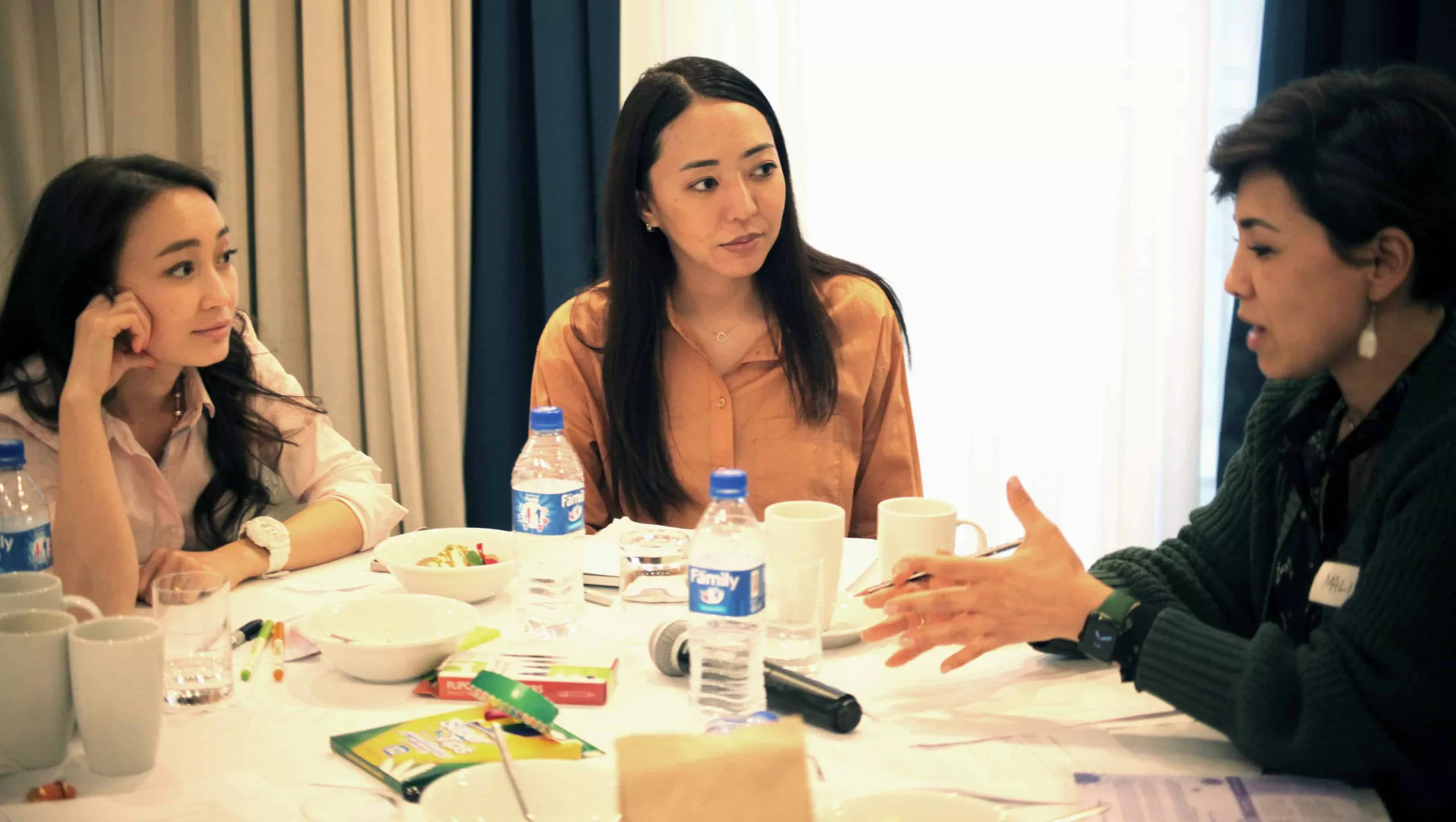 Arailym, Aigul and Malika_wide crop Women in discussion round table