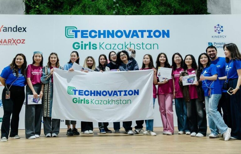 Girls from the Technovation Girls pgogramme in Kazakhstan pose with a flag