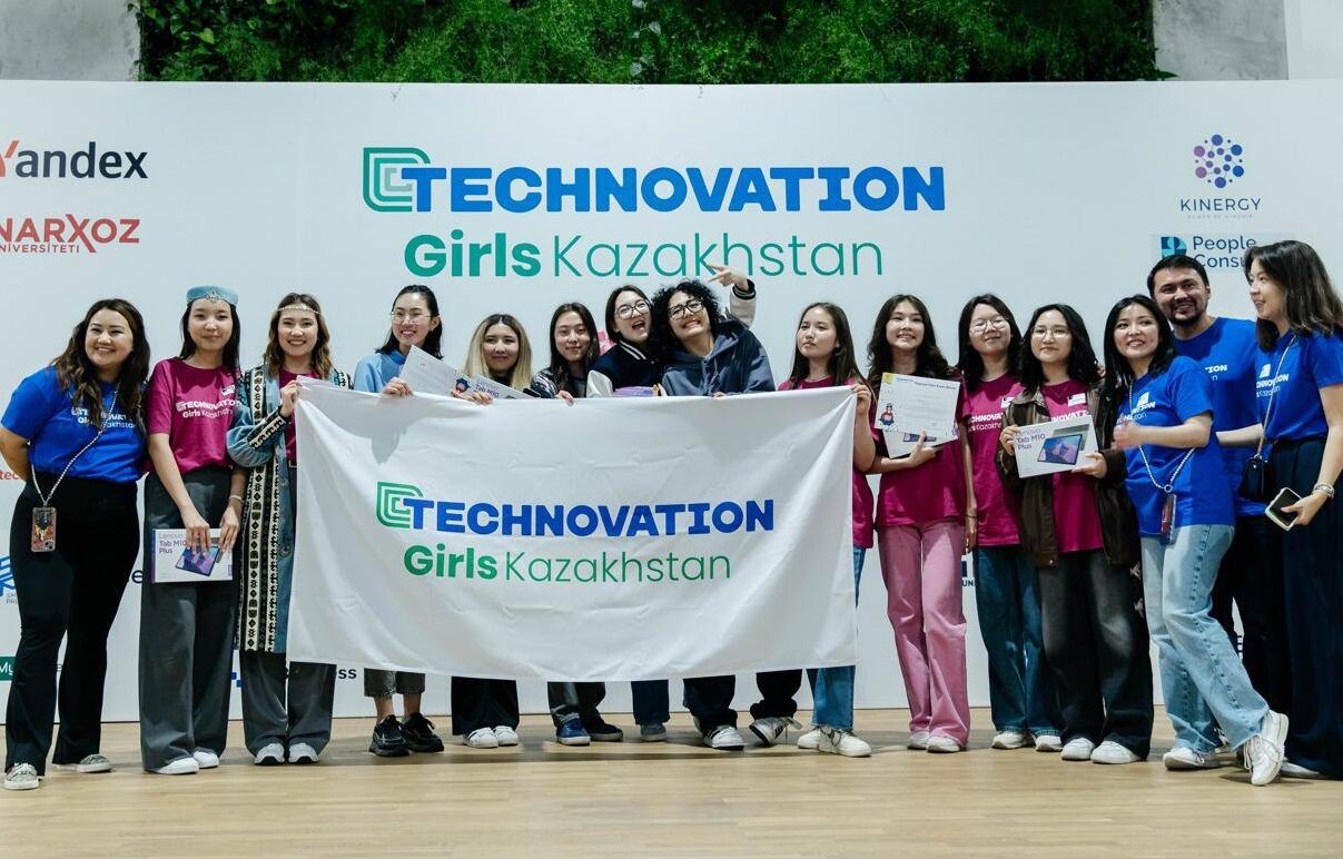Girls from the Technovation Girls pgogramme in Kazakhstan pose with a flag