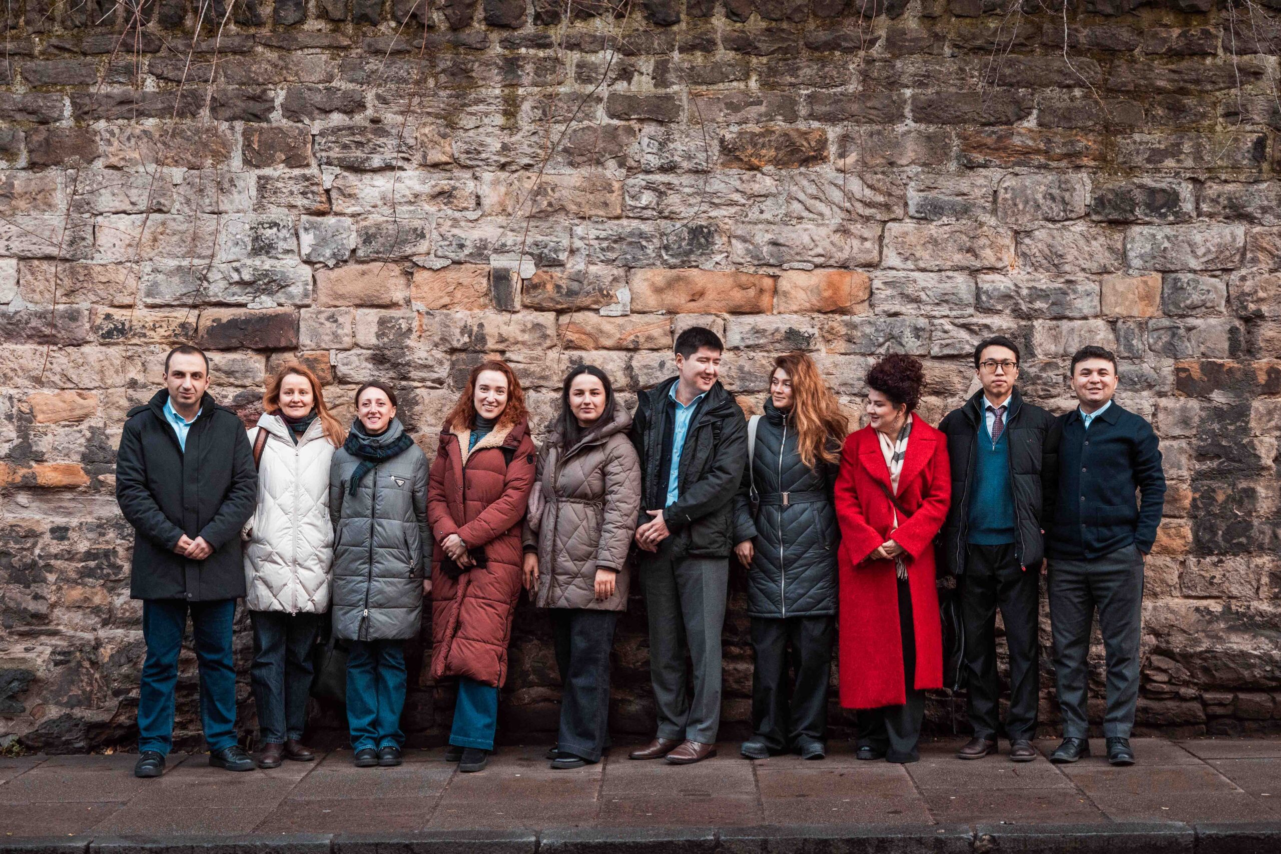 Fellows lined up against a wall