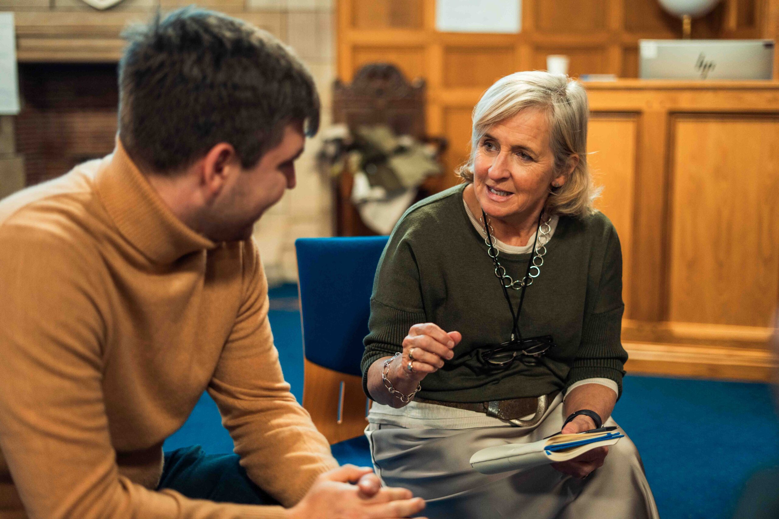 A woman in deep conversation with a man