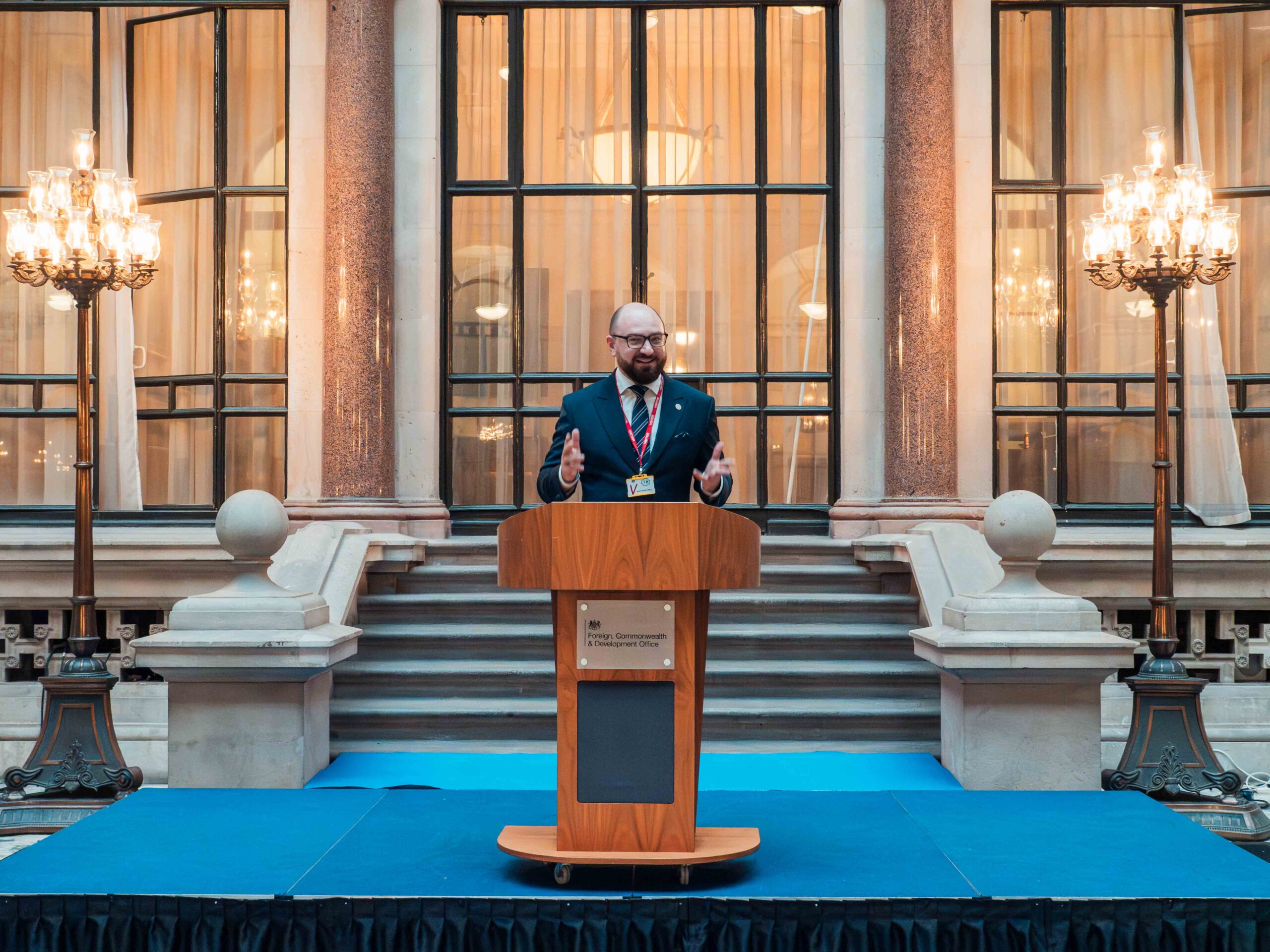 © Sarah Oughton Photography_John Smith Trust_Belarus programme_2025-49 Fellow at lectern in FCDO