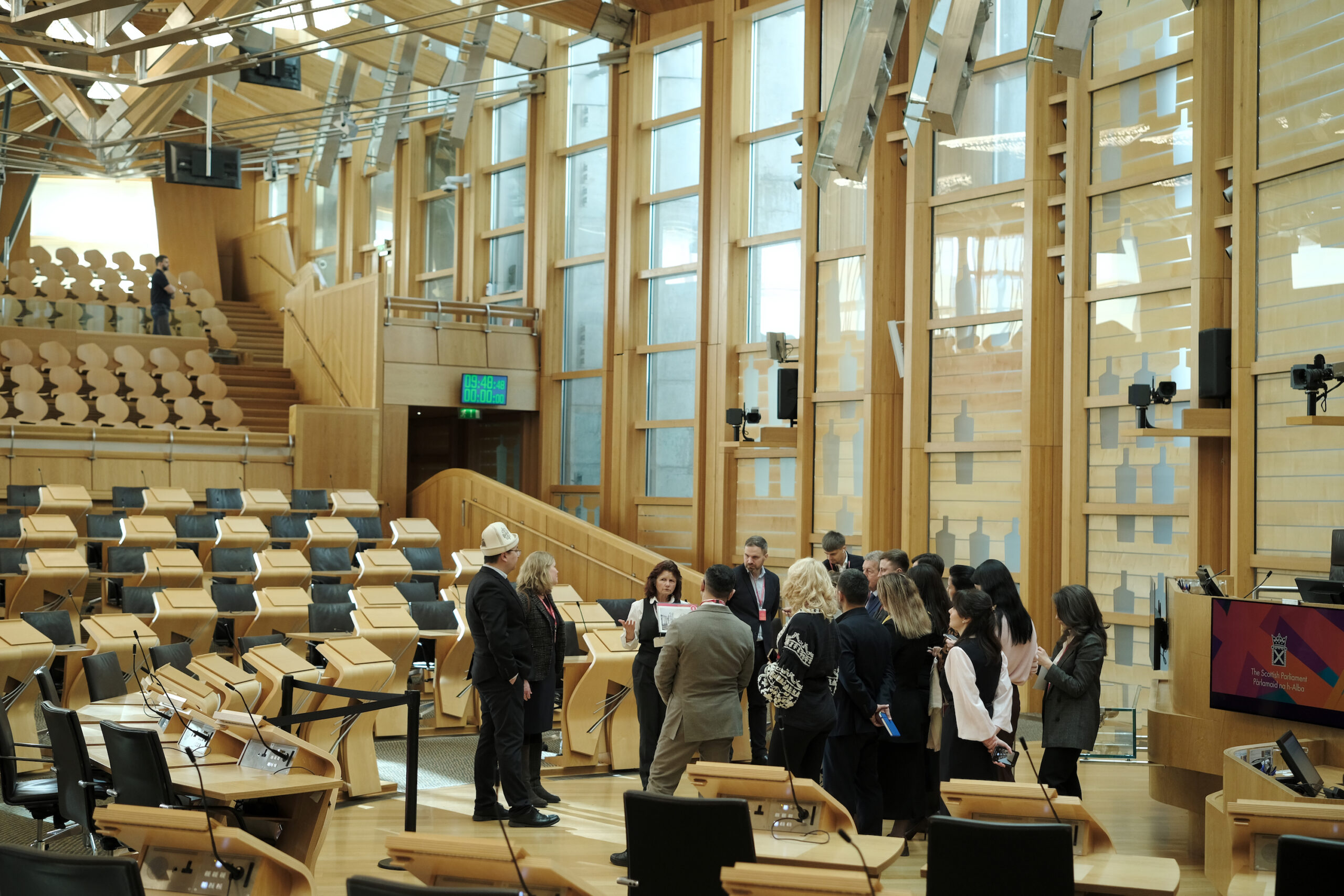 Scot parliament A large conference room with a group of people