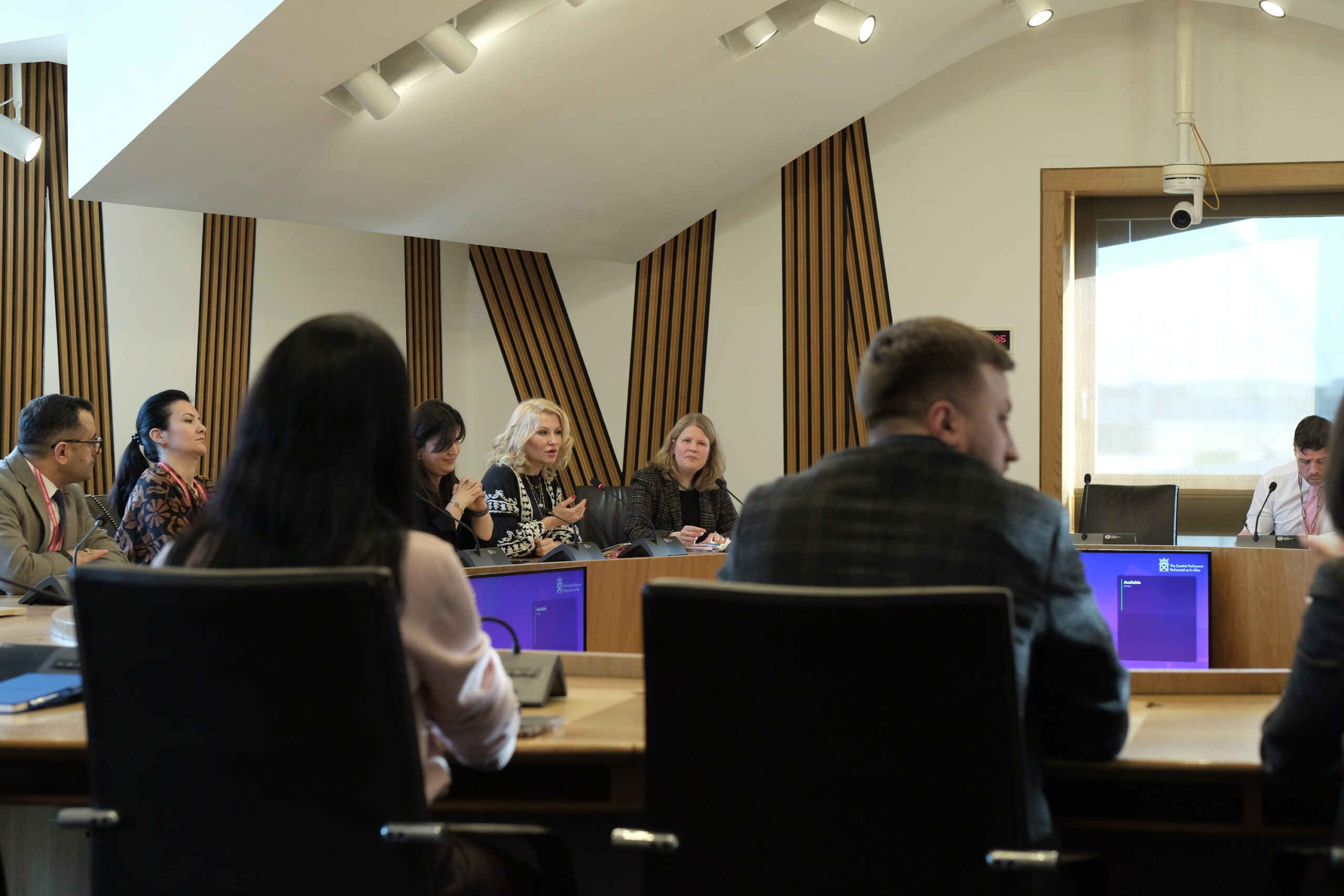 Fellows in conference room in discussion Fellows in conference room in discussion